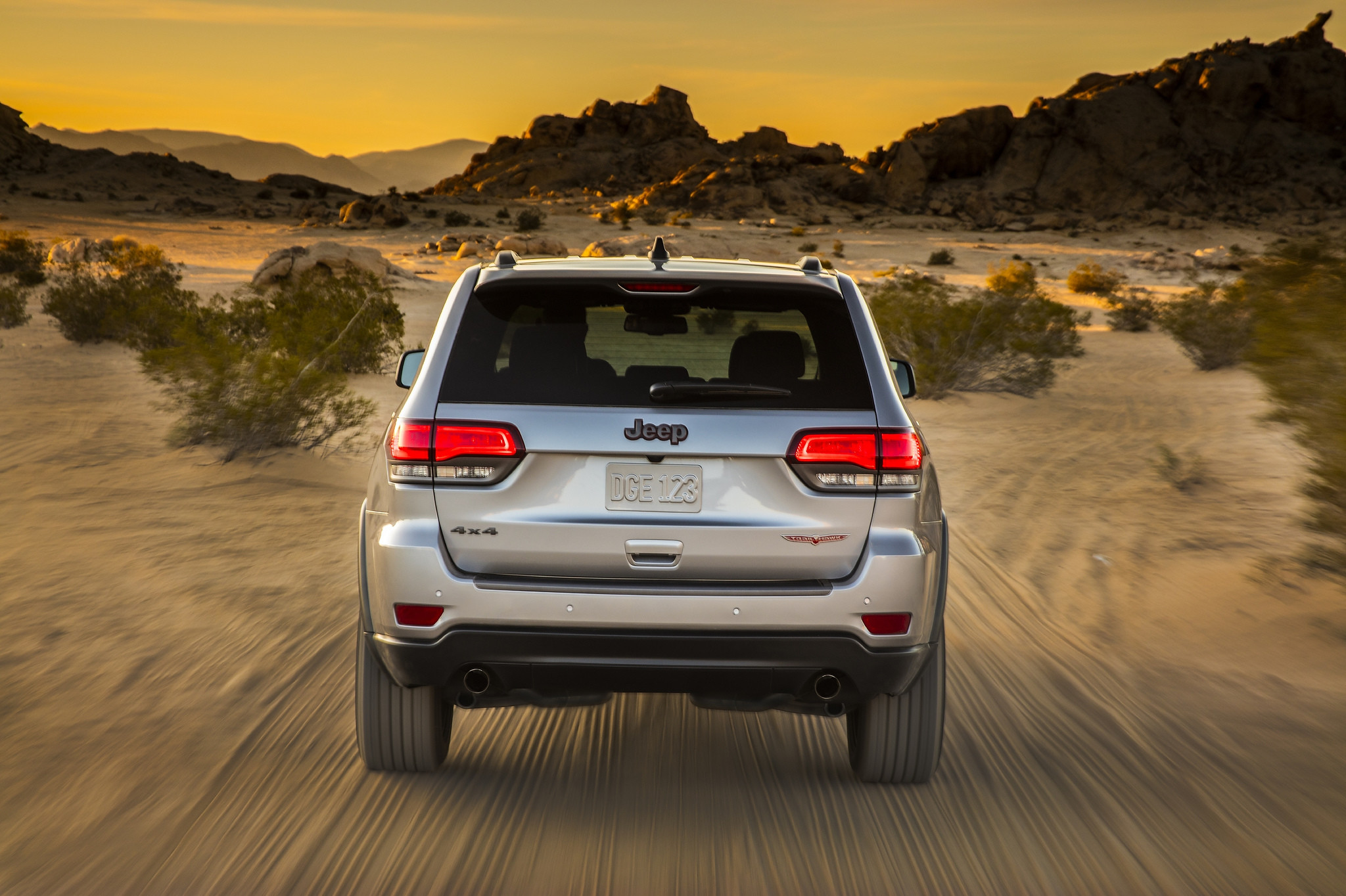 A Jeep Grand Cherokee driving in a desert