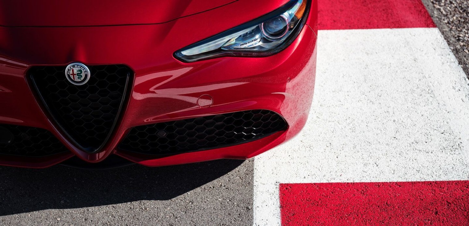 Top-down view of the red 2019 Alfa Romeo Giulia driving on a race track
