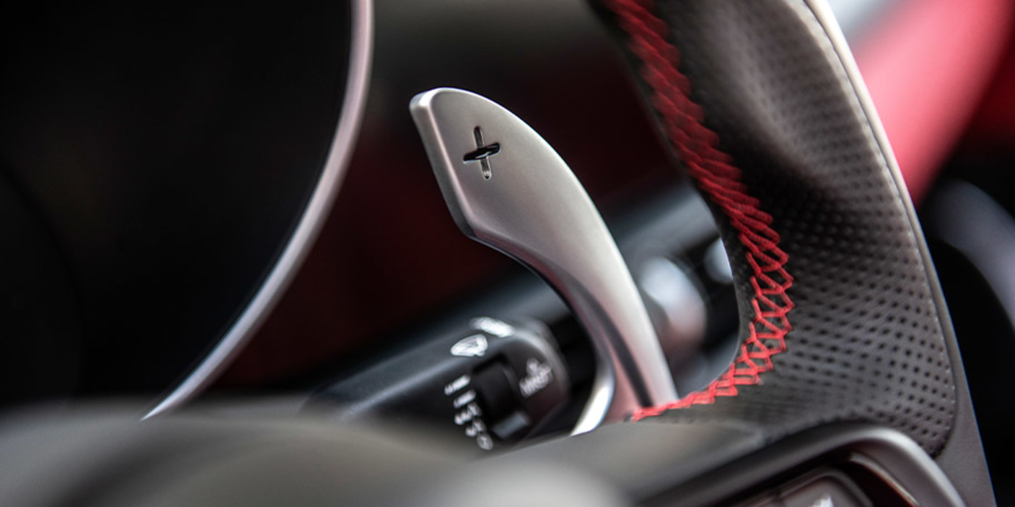 Close up view of 2021 Alfa Romeo Giulia steering wheel controls
