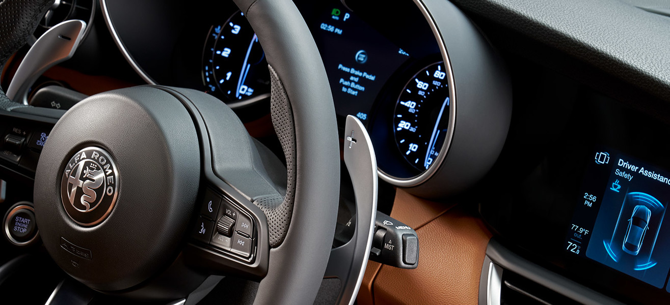 Close up of the 2021 Alfa Romeo Giulia steering wheel and display