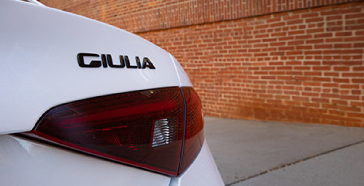 View of a rear light of the white 2022 Alfa Romeo Giulia.