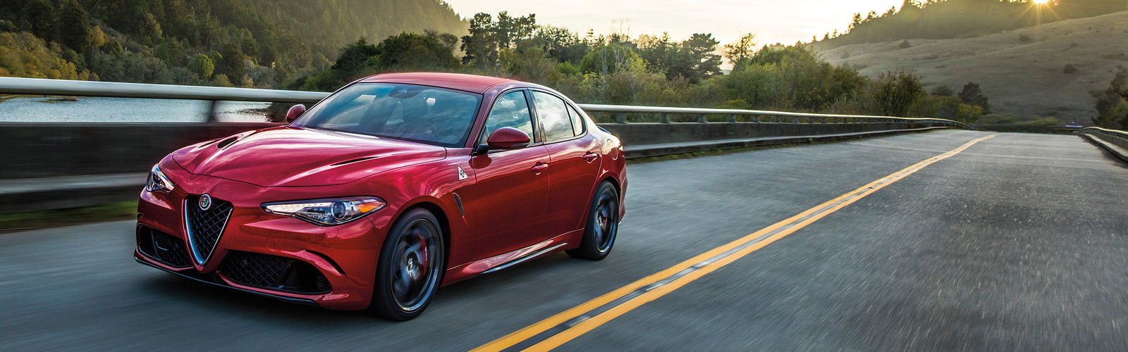 Red 2020 Alfa Romeo Giulia being driven on the road