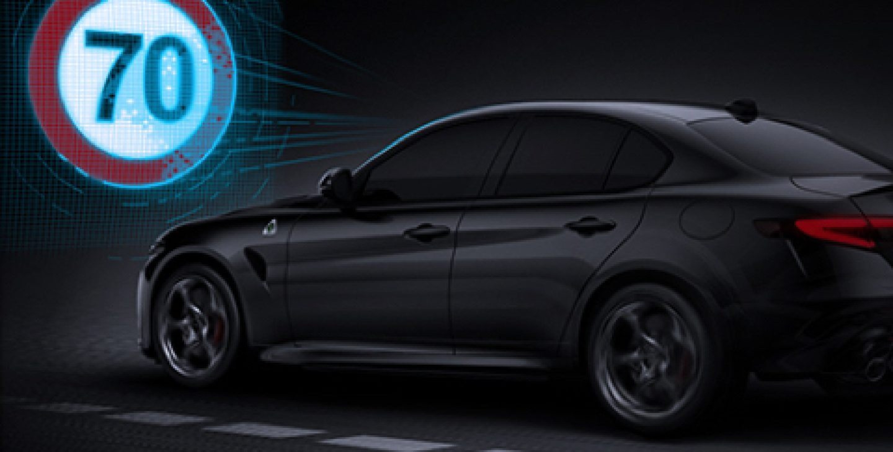 70 being projected from the windshield of the 2021 Alfa Romeo Giulia Quadrifoglio to demonstrate the system recognizing a traffic sign.