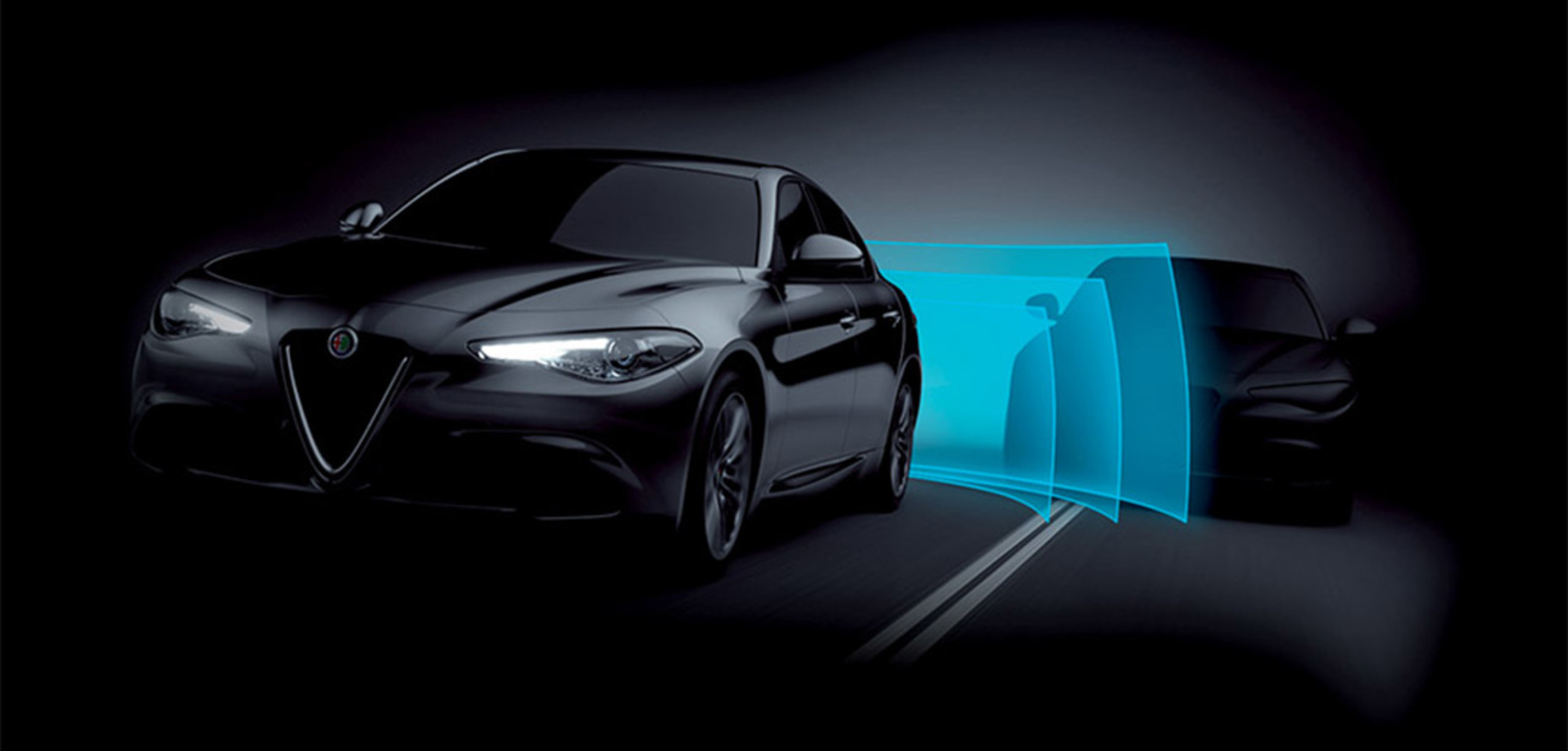 Night view of black 2024 Alfa Romeo Giulia Quadrifoglio front and rear park assist.