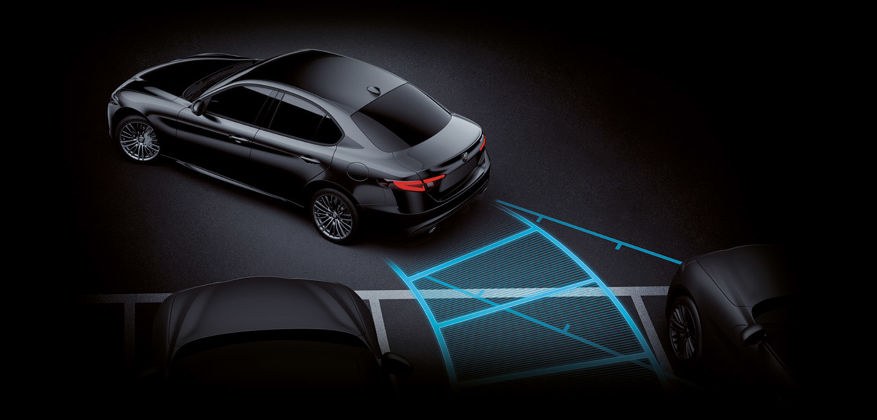 Night view of black 2023 Alfa Romeo Giulia Quadrifoglio front and rear park assist.