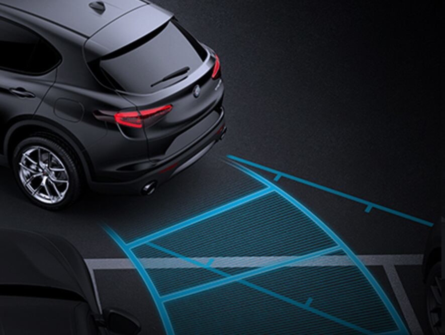 The sensors in the 2020 Alfa Romeo Stelvio tracking the path the vehicle is following as it reverses into a parking space.