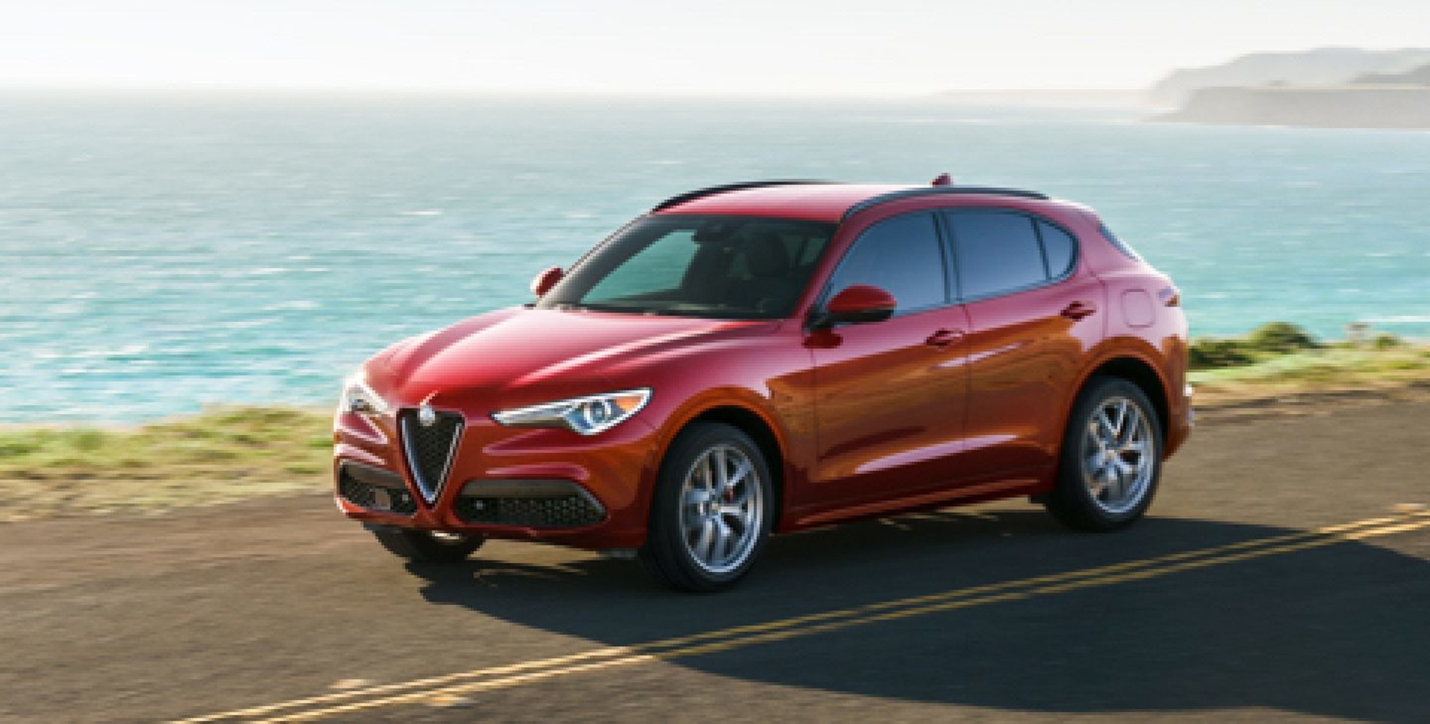 The 2020 Alfa Romeo Stelvio being driven on a coastal road.