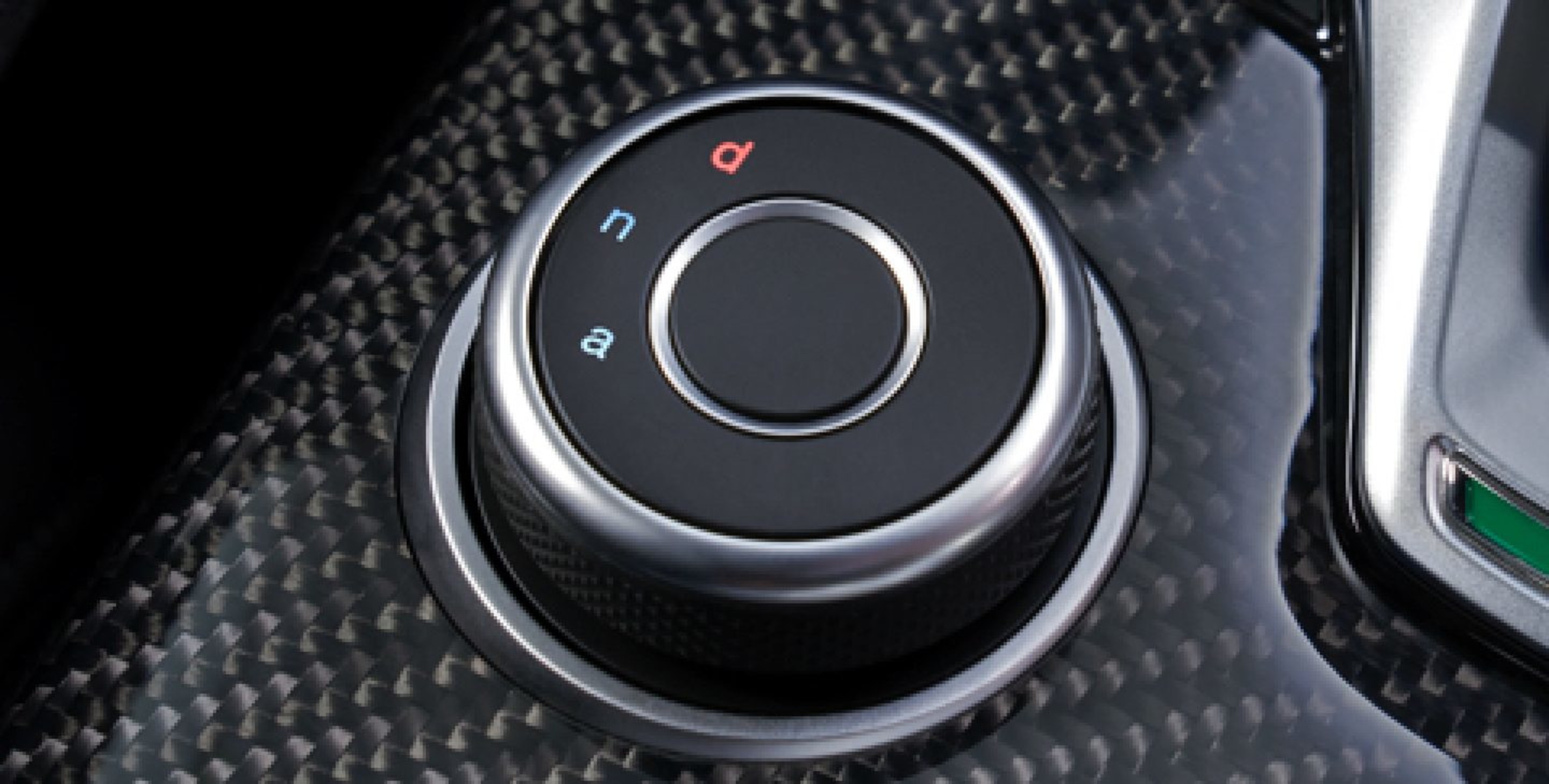 A close-up of the rotary DNA Drive Mode Selector dial on the 2020 Alfa Romeo Stelvio.