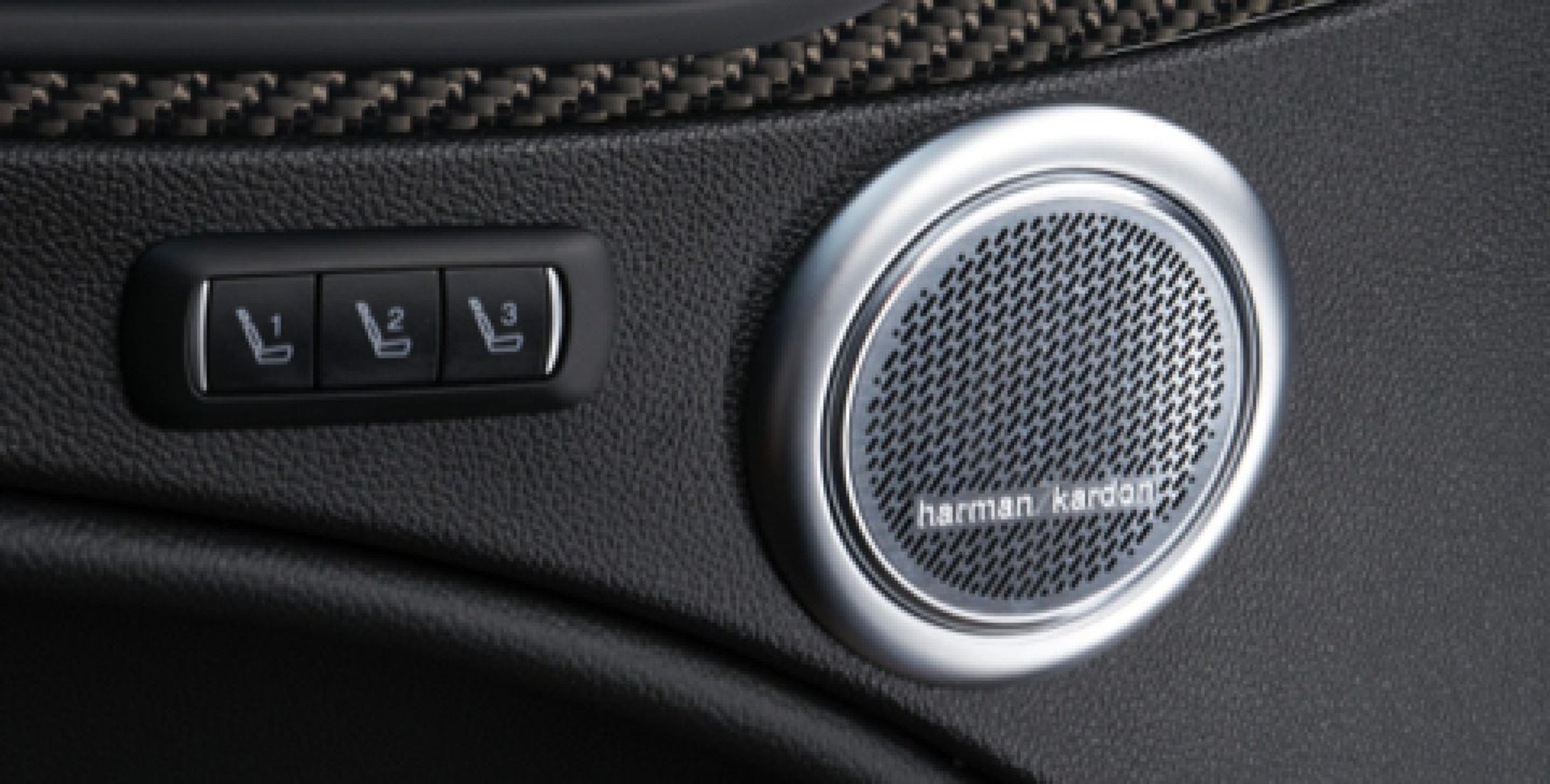 A close-up of the Harman Kardon speaker in the interior door panel of the 2020 Alfa Romeo Stelvio.