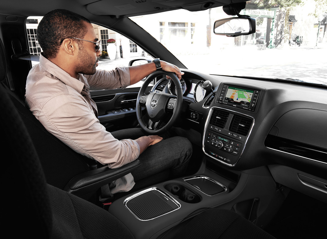 A man driving the 2020 Dodge Grand Caravan