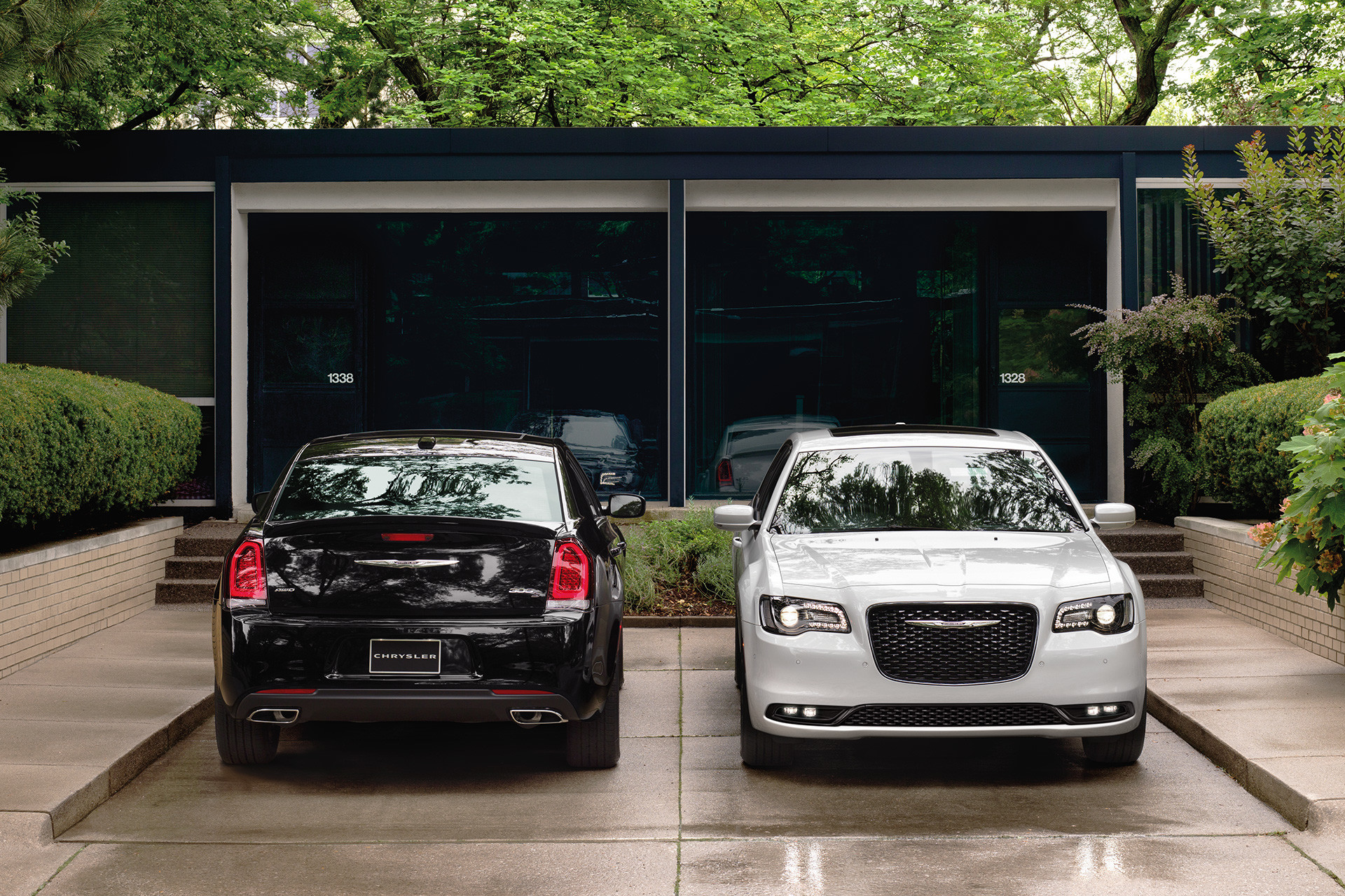 Two 2020 Chrysler 300 parked in a driveway besides each others