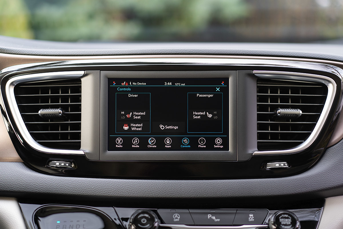 A close-up of the Uconnect multimedia system inside the 2021 Chrysler Grand Caravan.