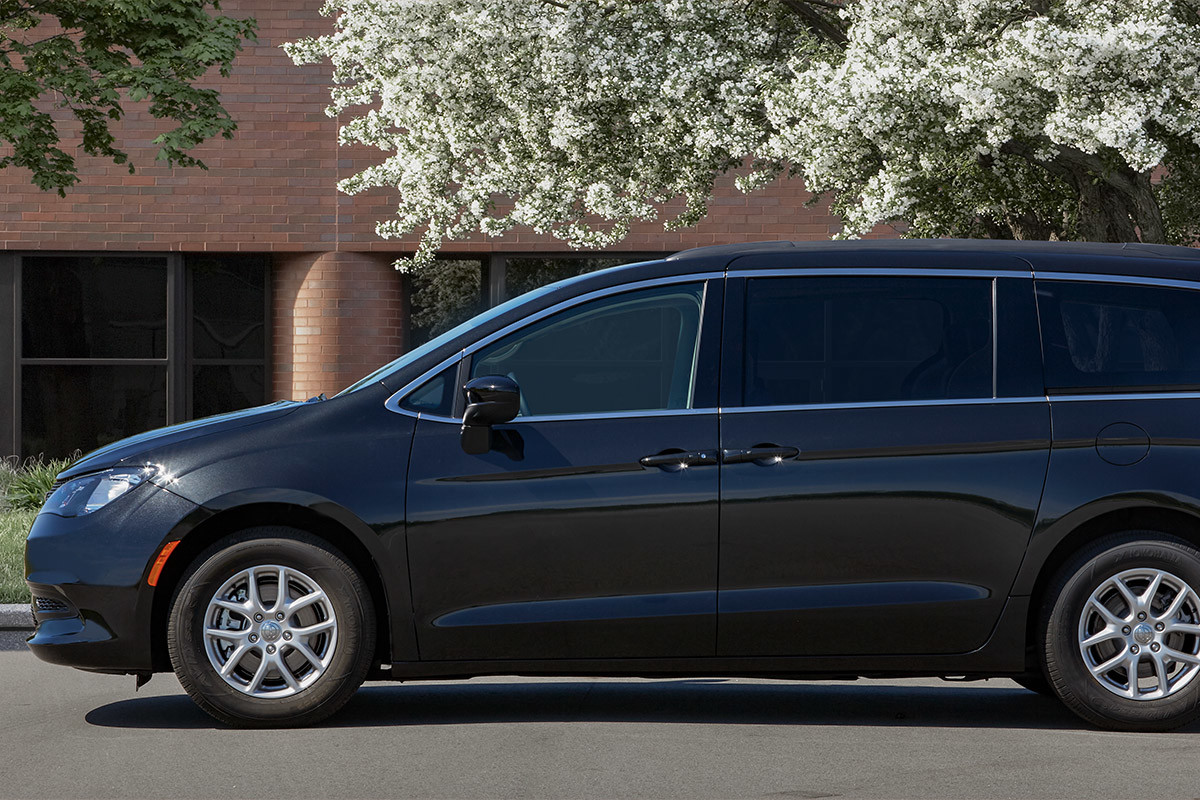 Side view of a parked blue 2022 Chrysler Grand Caravan