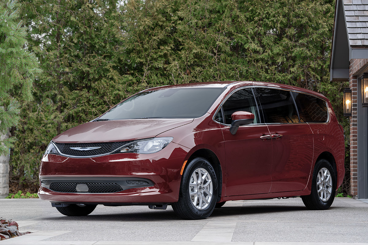 Front of a red 2022 Chrysler Grand Caravan parked in the driveway.