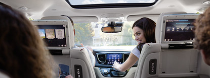 2019 Chrysler Pacifica woman using entertainment system