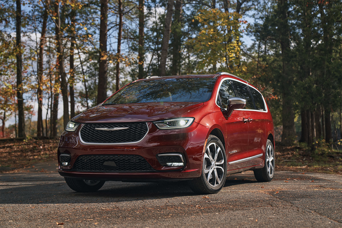 Front exterior grill view of a red Chrysler Pacifica.