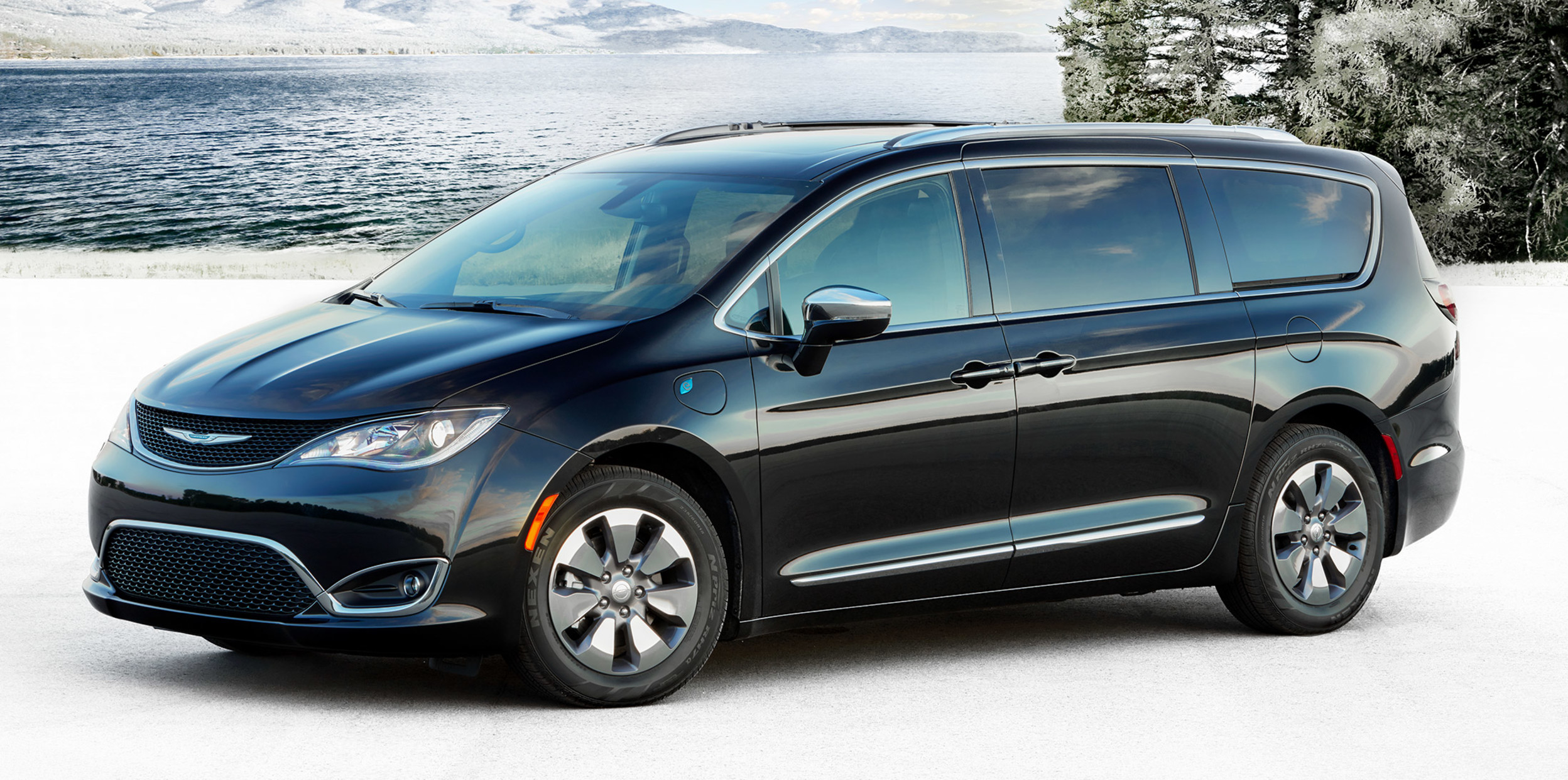 Black 2020 Chrysler Pacifica Hybrid parked on a snowy beach.