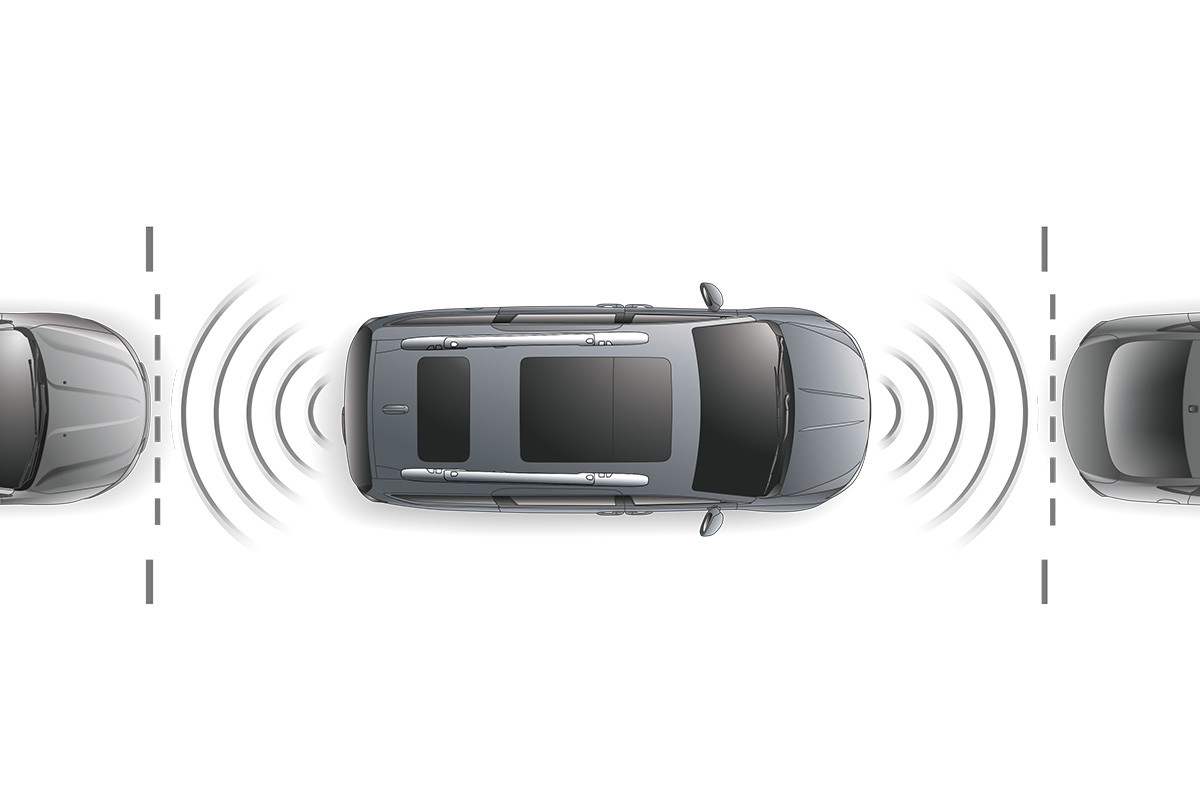 Birds eye view of the 2020 Chrysler Pacifica Hybrid parking between two cars highlighting its parking assist sensors