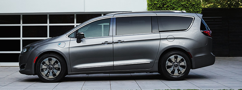 Side view of the silver 2020 Chrysler Pacifica Hybrid parked on a driveway