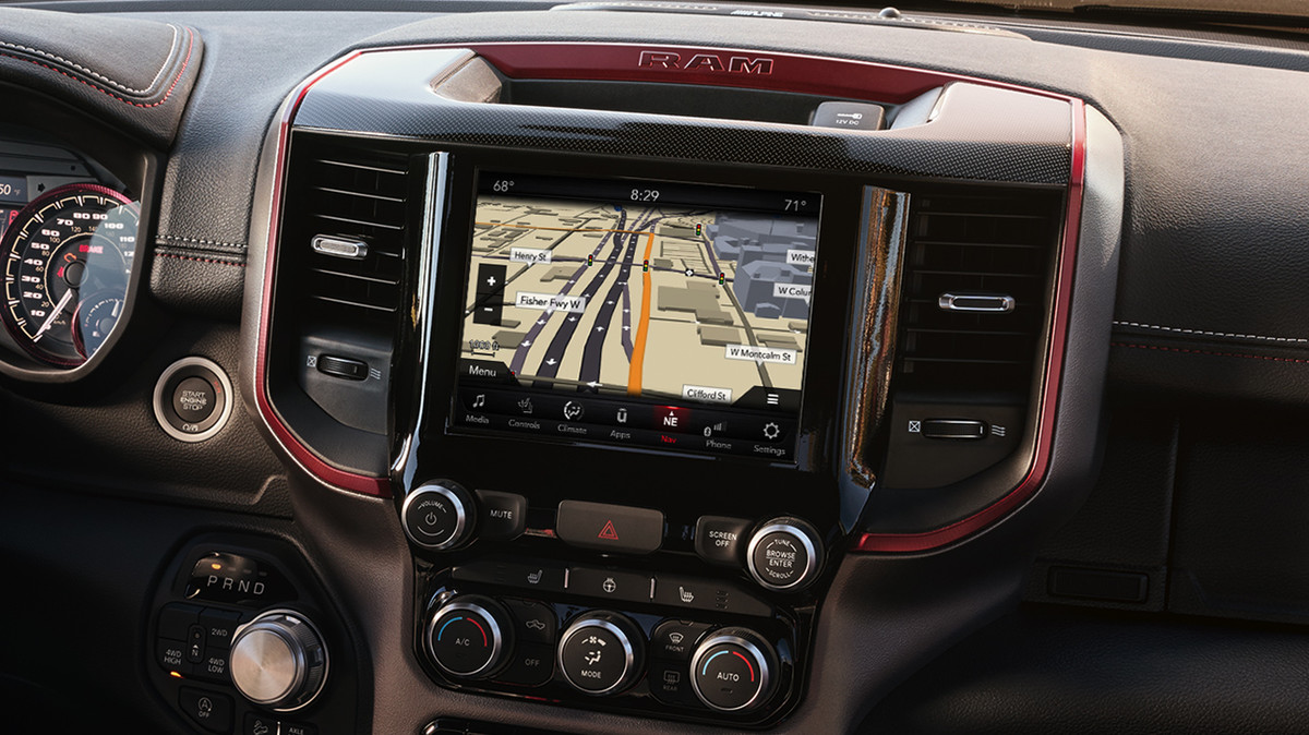 Close up of the dashboard showing the navigation screen and radio controls.