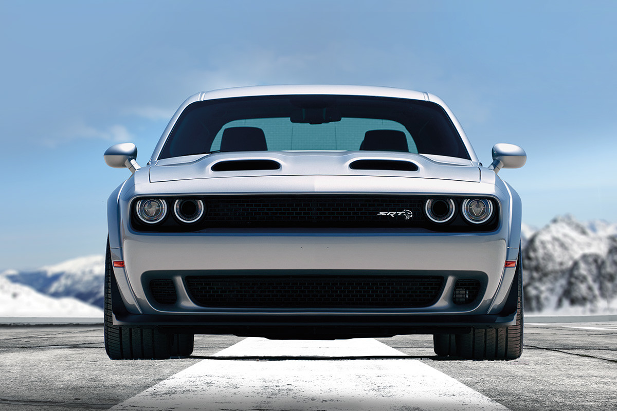 Front view of the silver 2019 Dodge Challenger SRT Hellcat parked on a paved road in the mountains