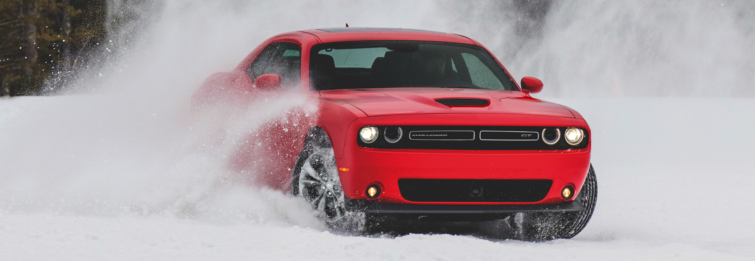 Red 2020 Dodge Challenger playing in the snow
