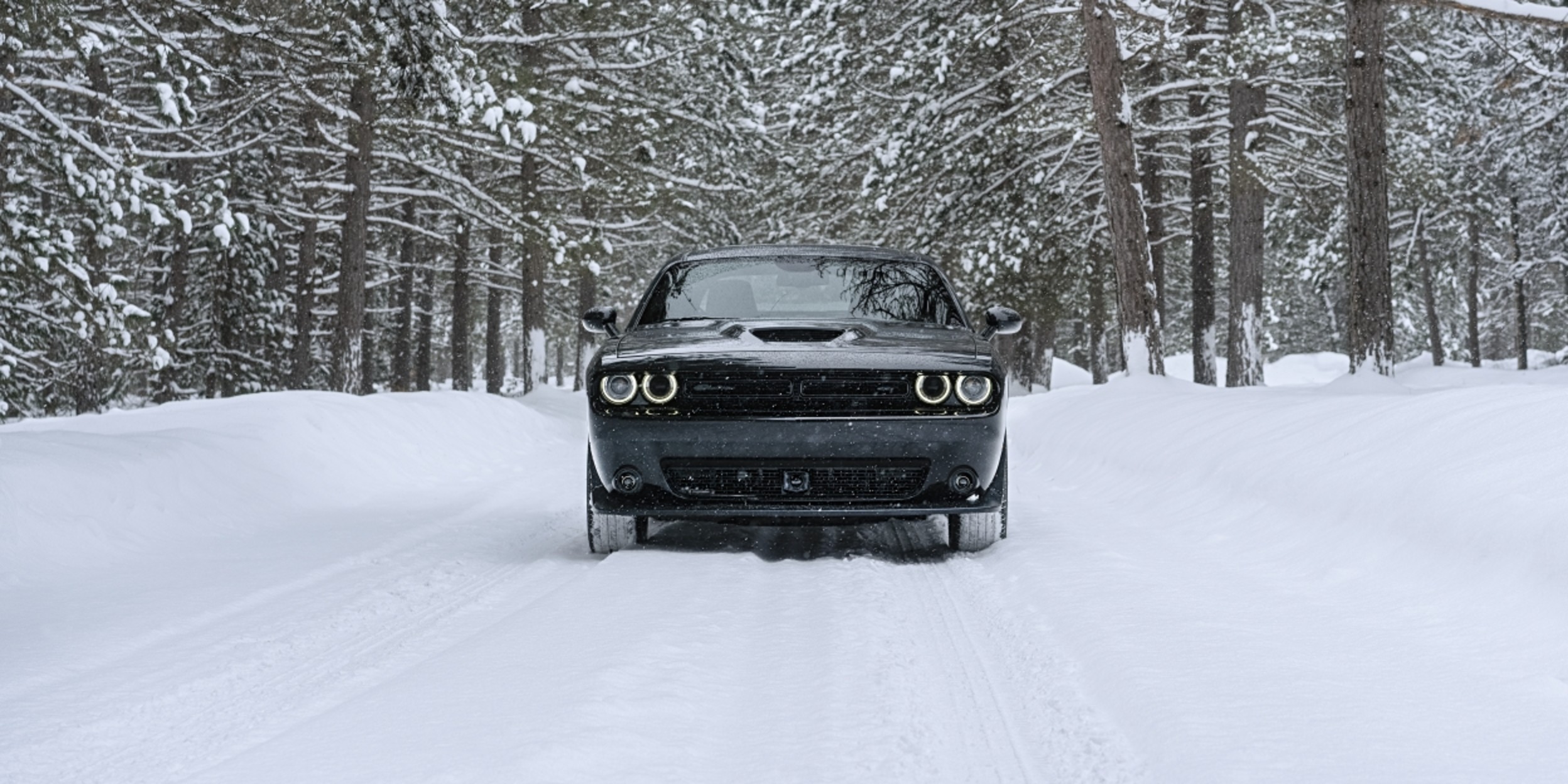 2021 Dodge Challenger GT driving in the snow.