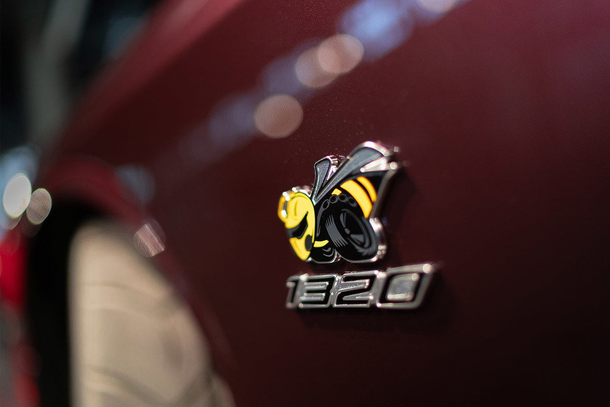 The Scat Pack 1320 logo on a red 2022 Dodge Challenger.