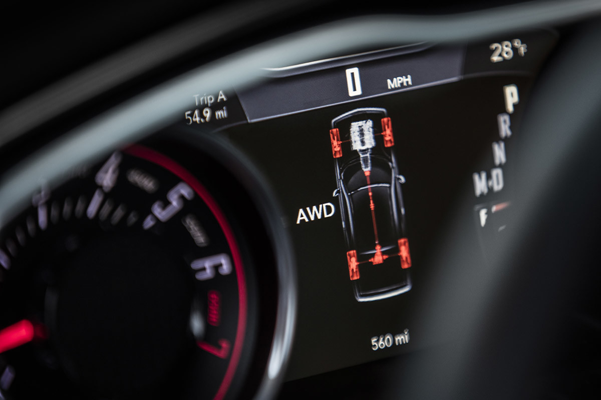 The full-colour 7-inch in-cluster display of a 2022 Dodge Challenger, displaying the AWD functionality.
