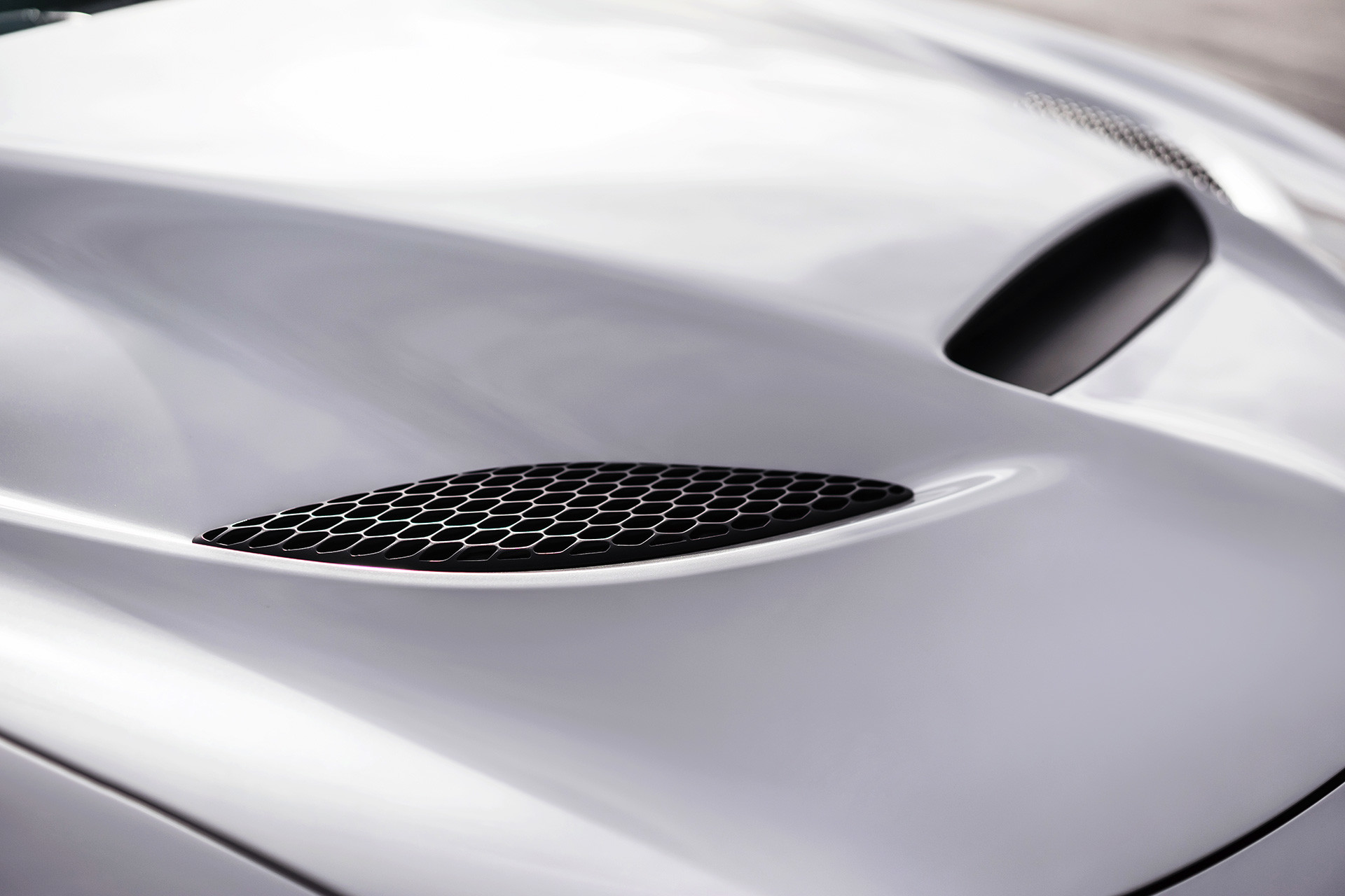 Functional hood scoop of the white 2020 Dodge Charger