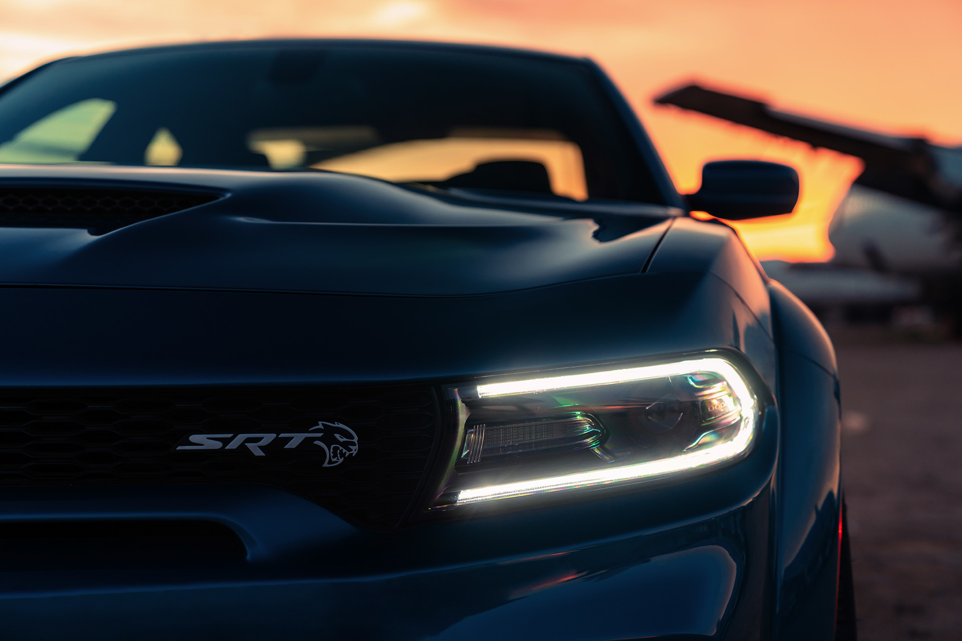 Close-up view of the headlights of the blue 2020 Dodge Charger while LED daytime running light on