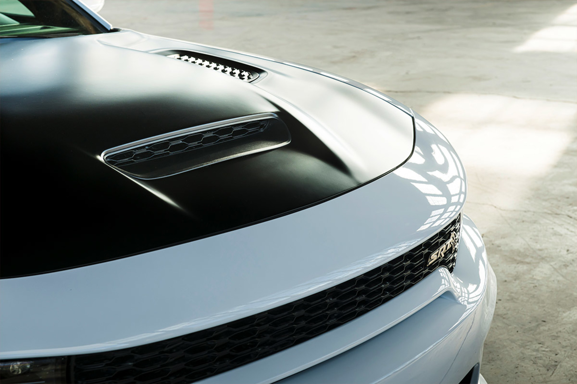 Close up view of the 2021 Dodge Charger hood in satin black