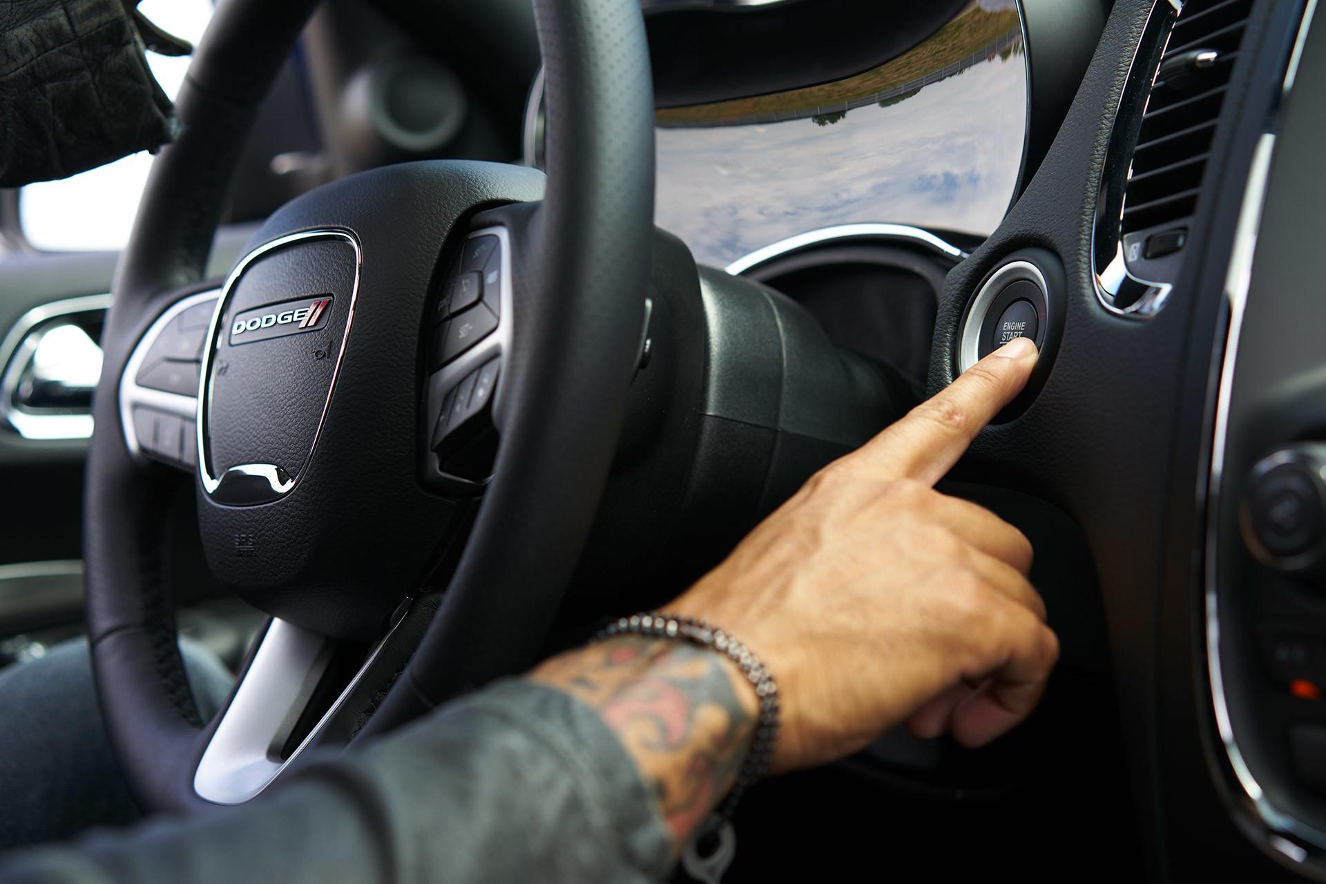 Person pressing push button start of 2020 Dodge Durango