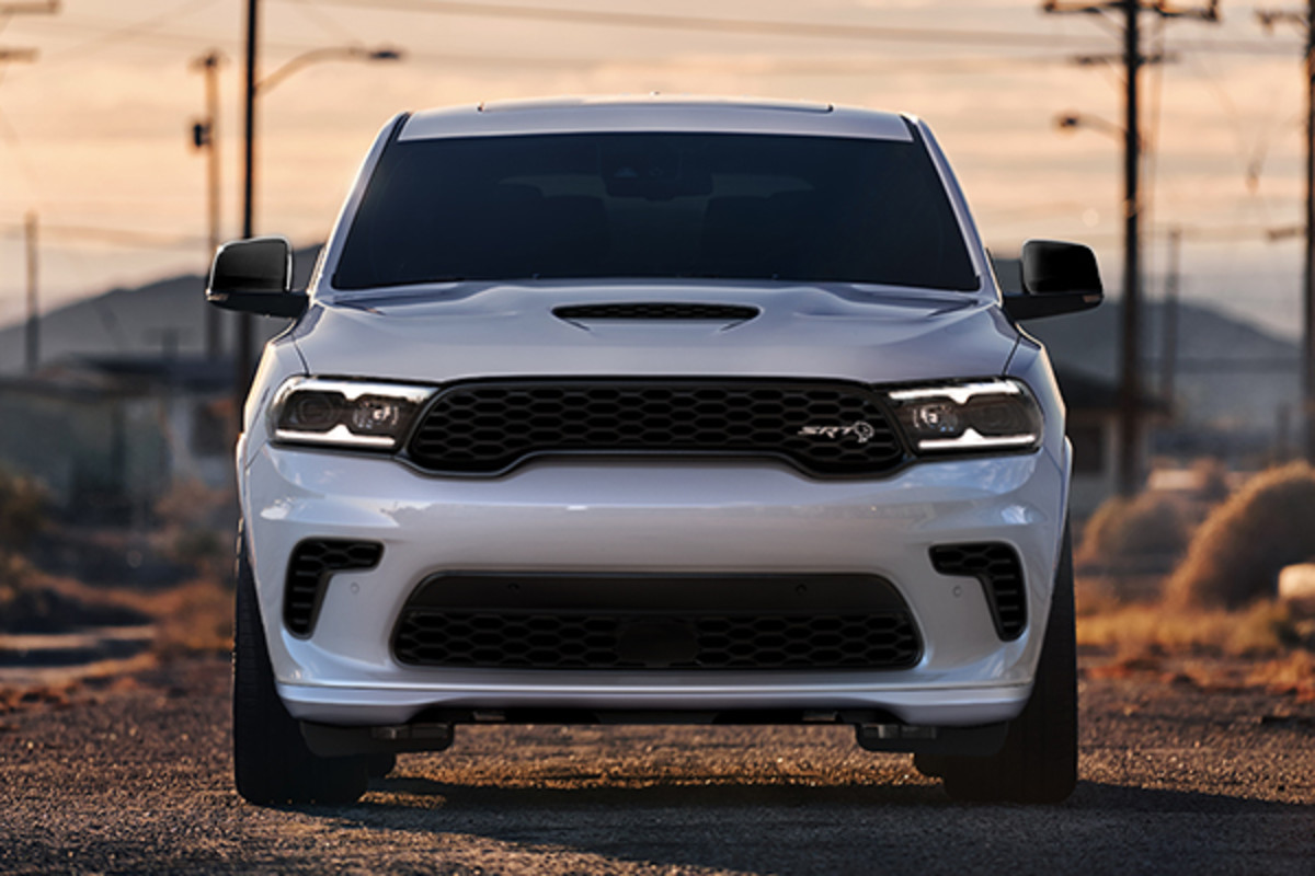 Front view of a 2023 Dodge Durango parked on a gravel road.