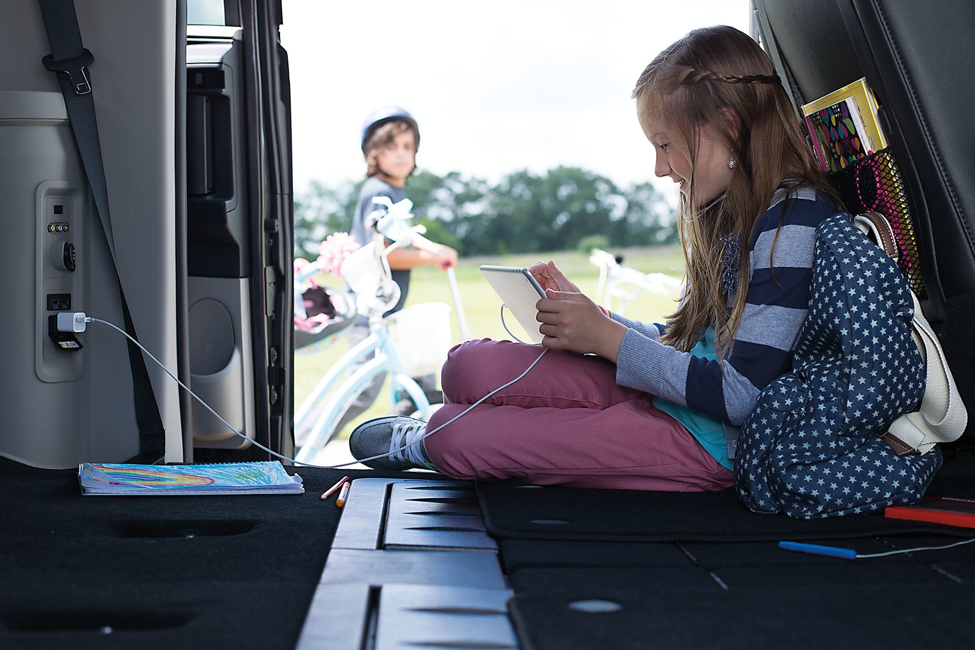 2019 Dodge Grand Caravan interior view of child charging a device