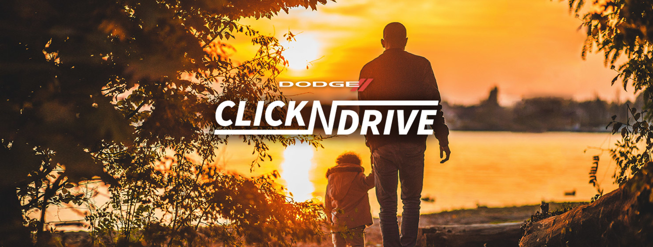 Drive Forward. Father and child walking towards the water at sunset