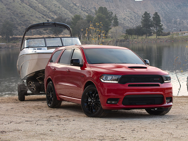 Red 2020 Dodge Durango towing a boat
