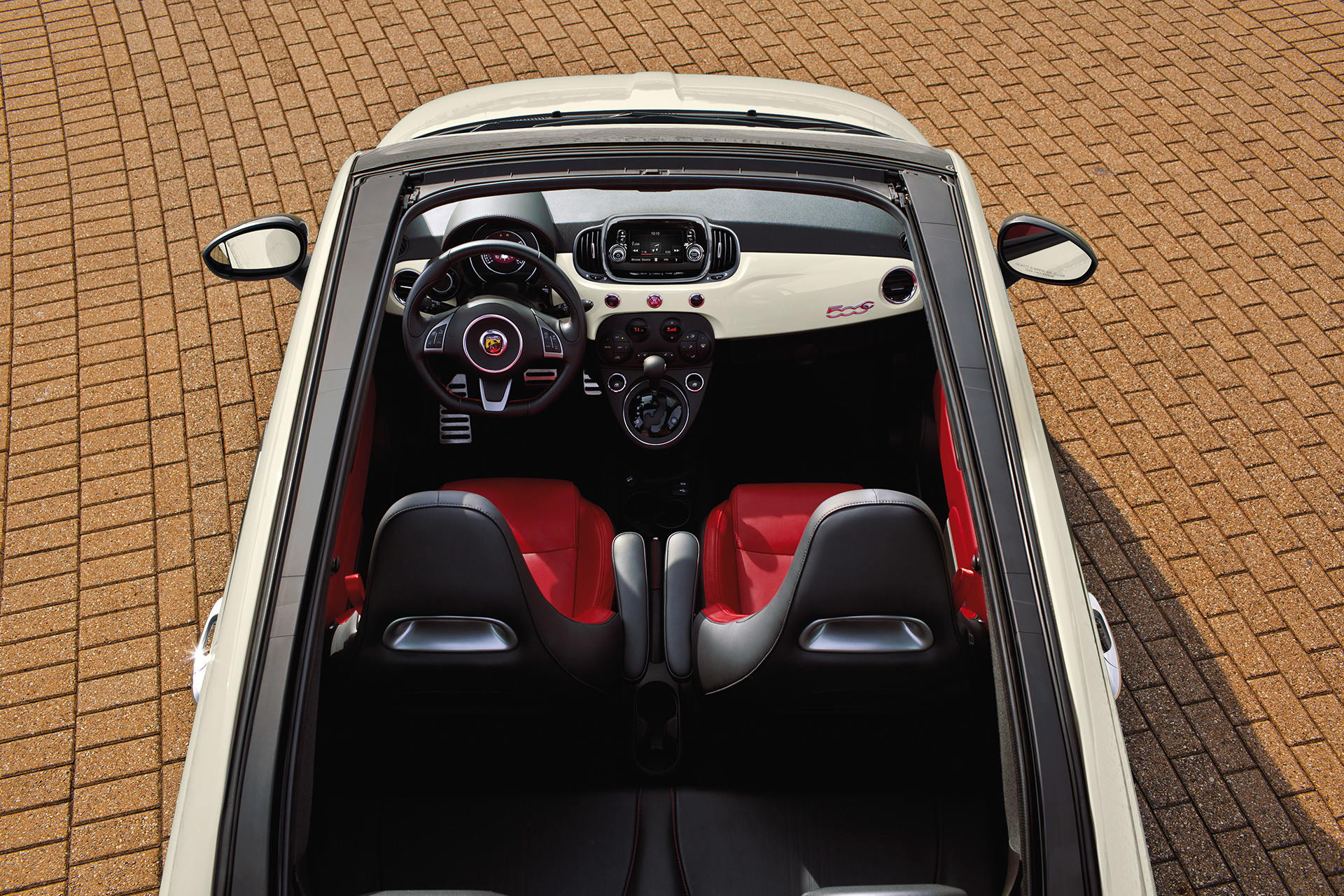 Angled bird’s eye view of a white 2019 FIAT® 500 showcasing the interior of the vehicle.