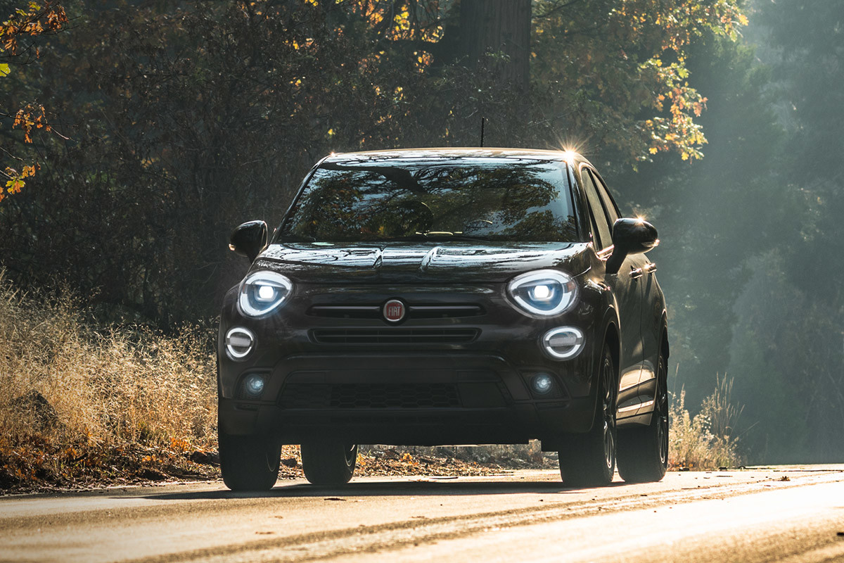 Front view of a black FIAT 500X parked on a dirt road
