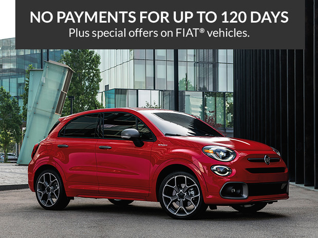 No payments for up to 120 days. Plus special offers on FIAT® vehicles. Red FIAT® 500X, parked in front of a building.