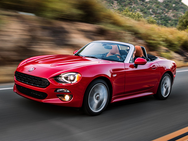Red 2019 FIAT 124 Spider being driven fast on the highway