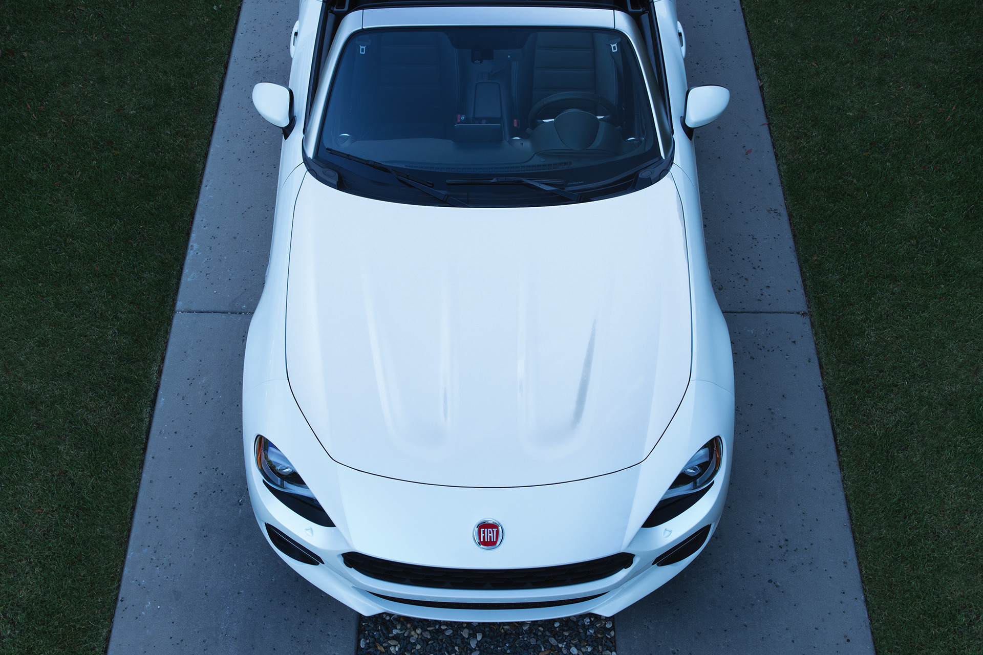 2019 Fiat 124 Spider front side aerial view, shown in white