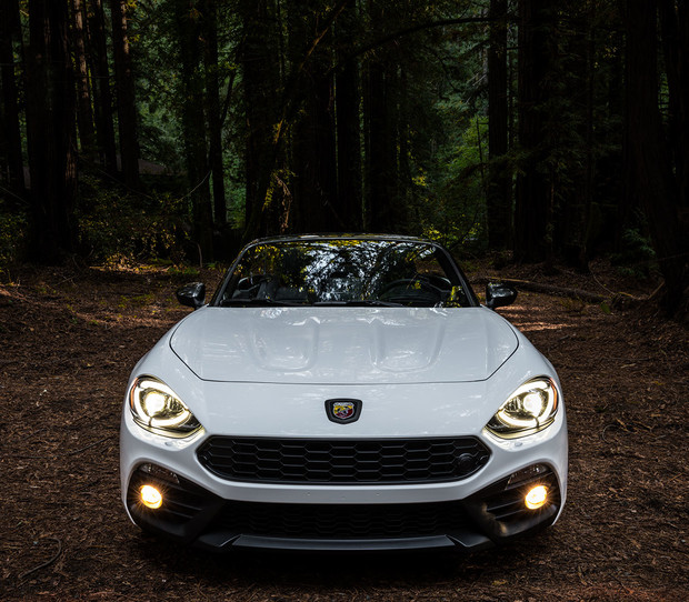 2019 Fiat 124 Spider driving down highway, show in red
