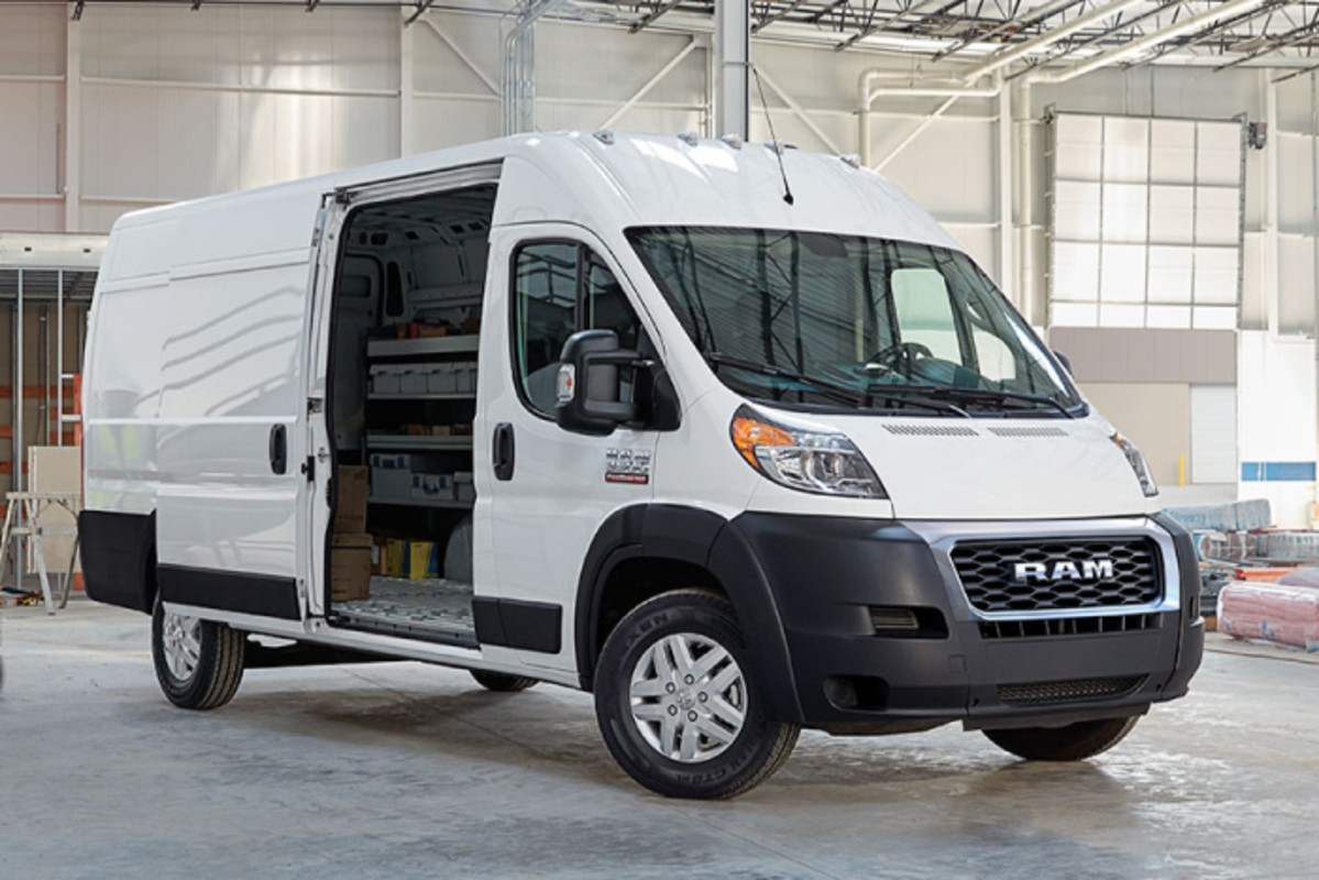 A white RAM Promaster with the side door open.