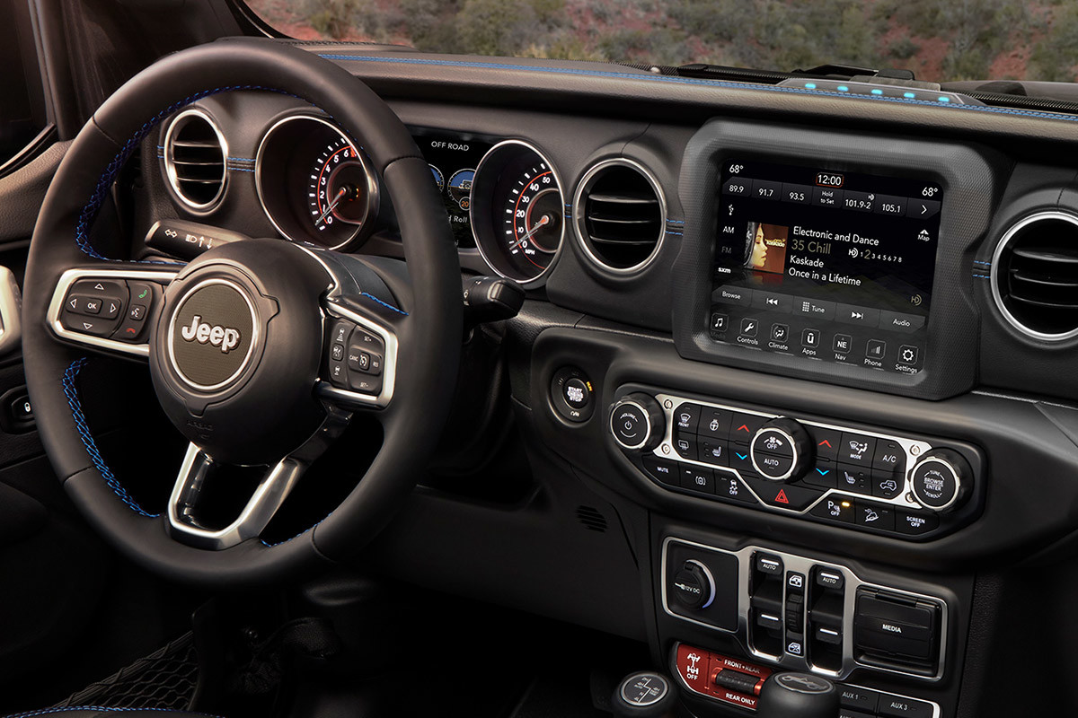 Internal view inside the 2022 Jeep Wrangler 4xe, featuring a mountain filled background