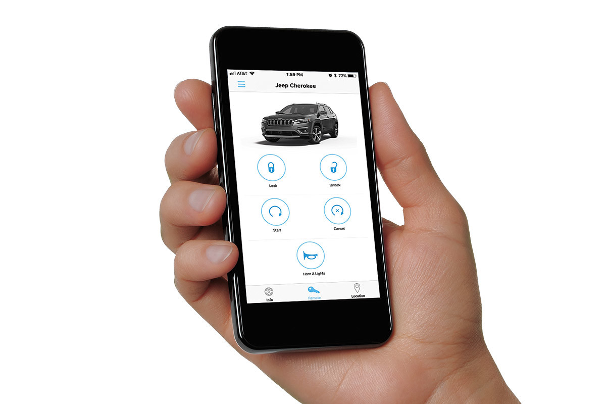 Hand holding a smartphone displaying the SiriusXM Guardian interface.