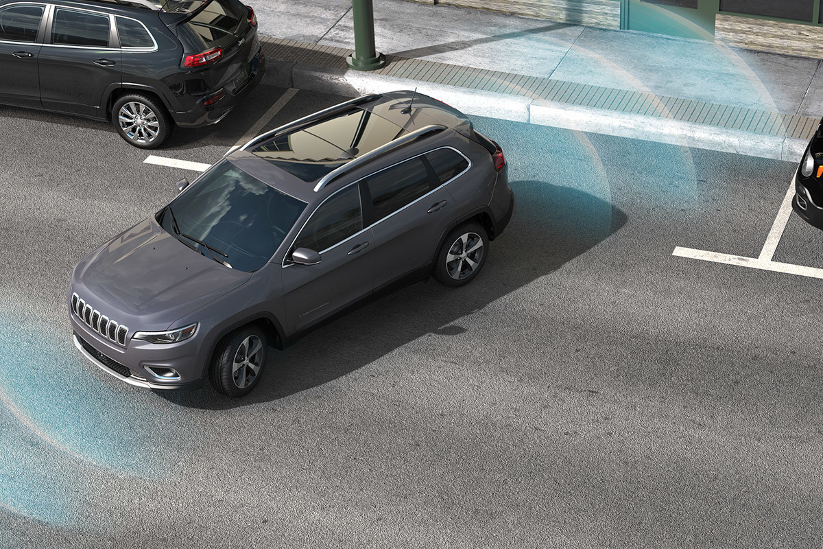 Graphic of a 2021 Jeep Cherokee parallel parking. A visual representation of the Park Assist sensors is shown.