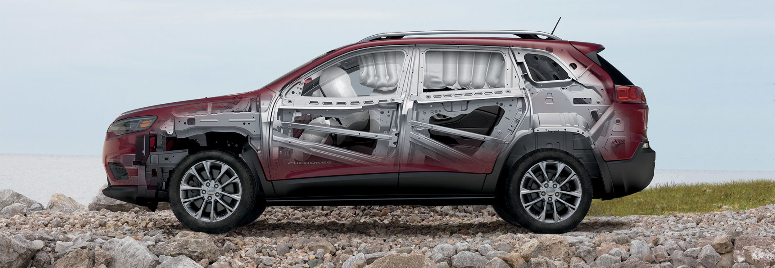 Cutaway image of the 2022 Jeep Cherokee SUV showing its protective frame and airbags.
