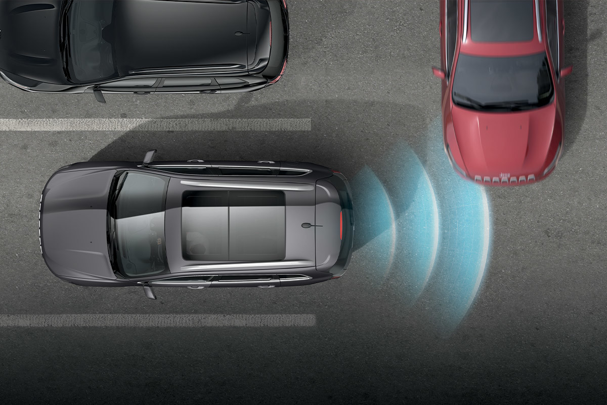 Graphic of a 2021 Jeep Cherokee backing out of a parking spot while a vehicle approaches from the side. A visual representation of the Park-Sense sensors is shown.