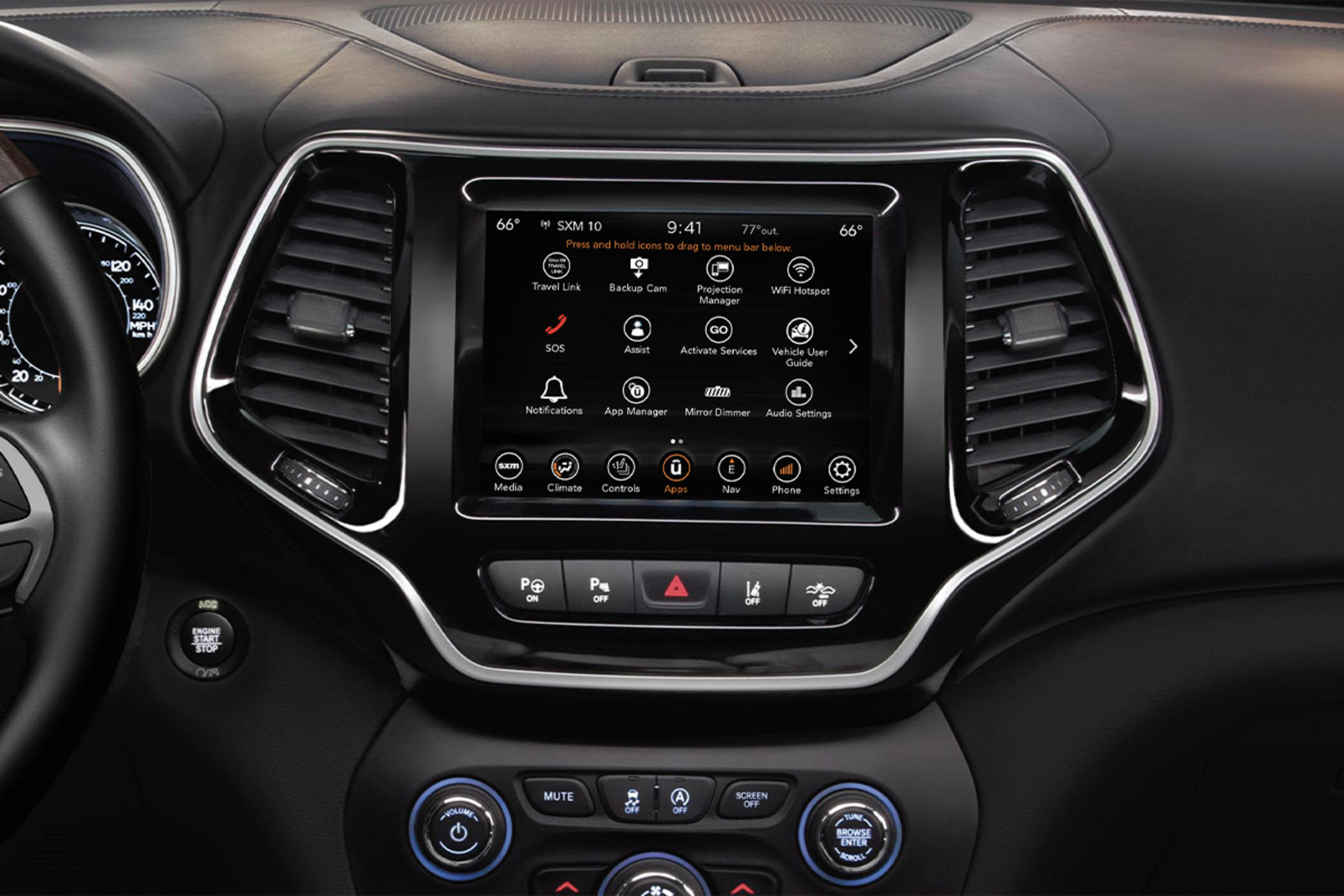 The interior of the 2022 Jeep Cherokee SUV, showing the touchscreen and instrumentation.